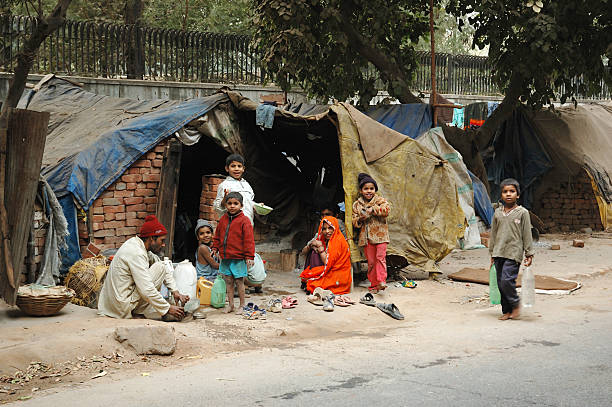 "Delhi,India - December, 12th,2007: Poor family at slum area,millions people of India doesn't have normal housing because of overcrowding problem"